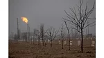 Oil wells and flares near farm